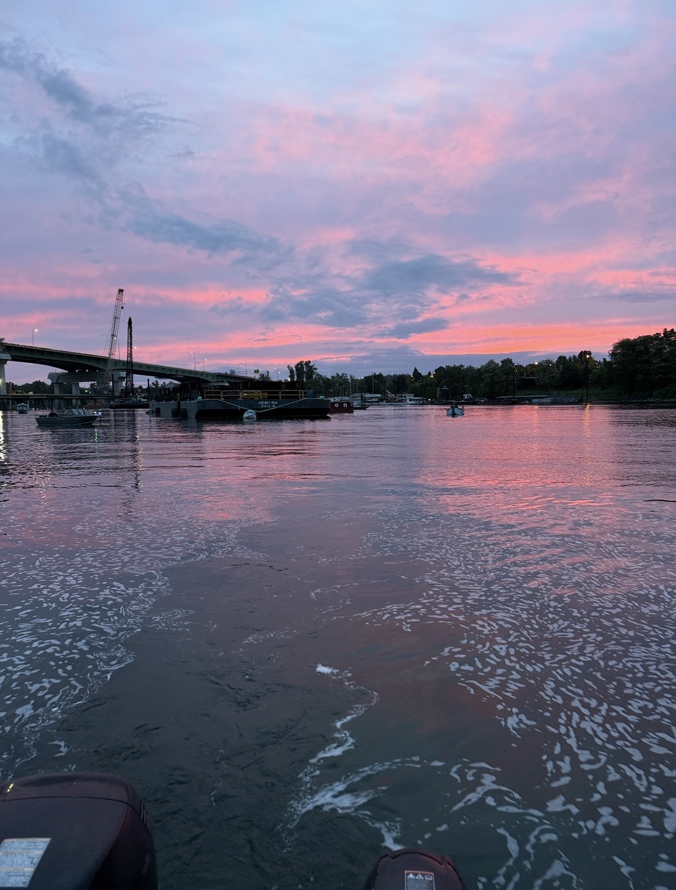 Pink and purple sunset sky over the Columbia River with the bridge