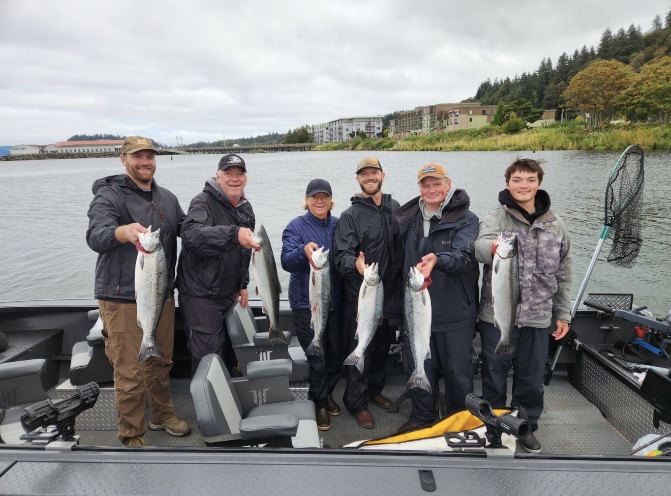 Six clients on the boat with a salmon catch in Astoria