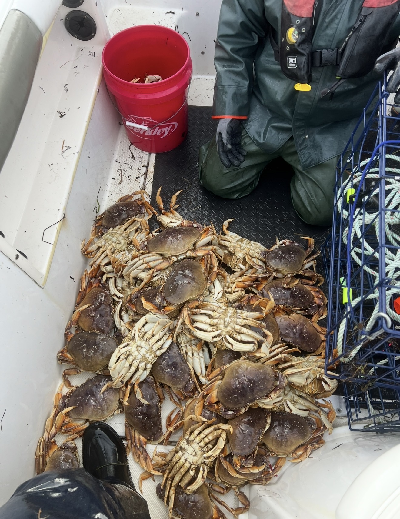 Captain Judd and family with a huge spread of Dungeness crab at home