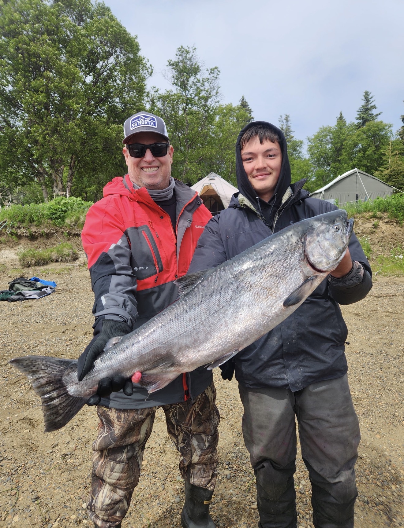 Client holding a huge bright Alaska king salmon