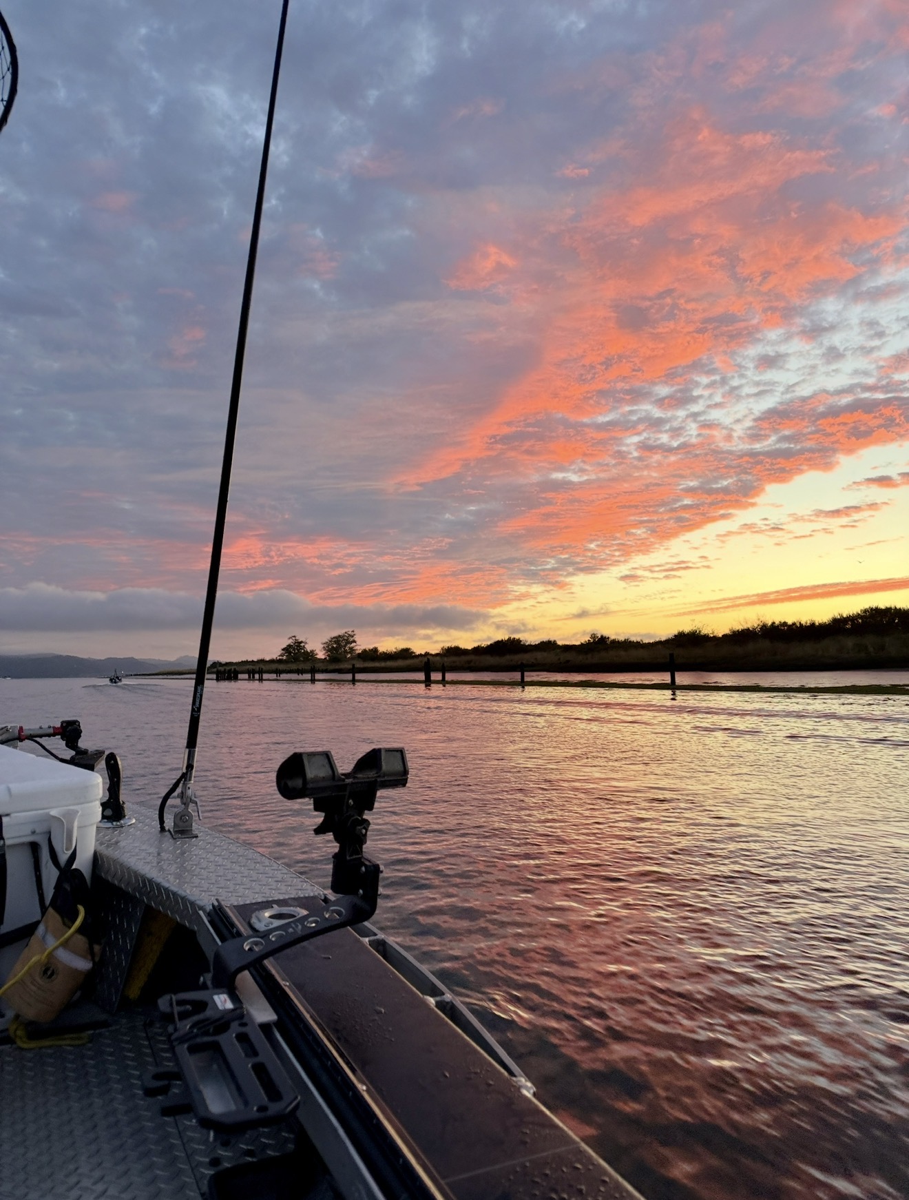 Sunrise sky from the bow of the boat leaving Astoria