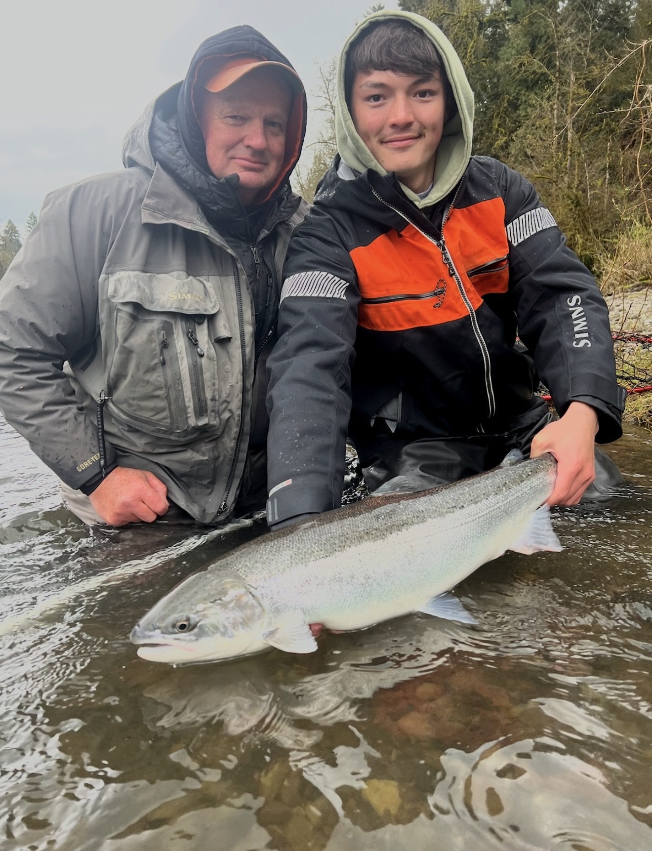 Captain Judd and a client releasing a wild steelhead