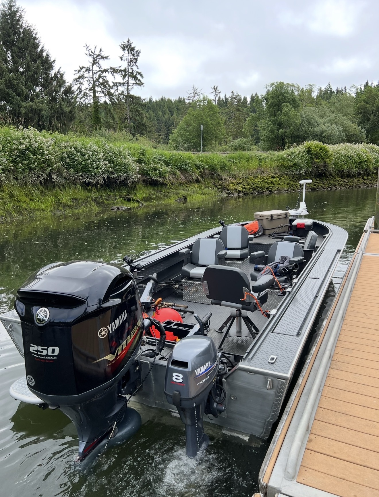 The Willie sled tied to the dock with Yamaha 250 VMAX main and 8hp kicker